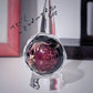 Florombra - Anello in alluminio wire con cabochon nero e fiore rosso antico con pagliuzze iridescenti
