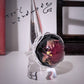 Florombra - Anello in alluminio wire con cabochon nero e fiore rosso antico con pagliuzze iridescenti