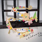 GirodiFiori — avvolgente bracciale con fiori e foglie in resina e perline di vetro